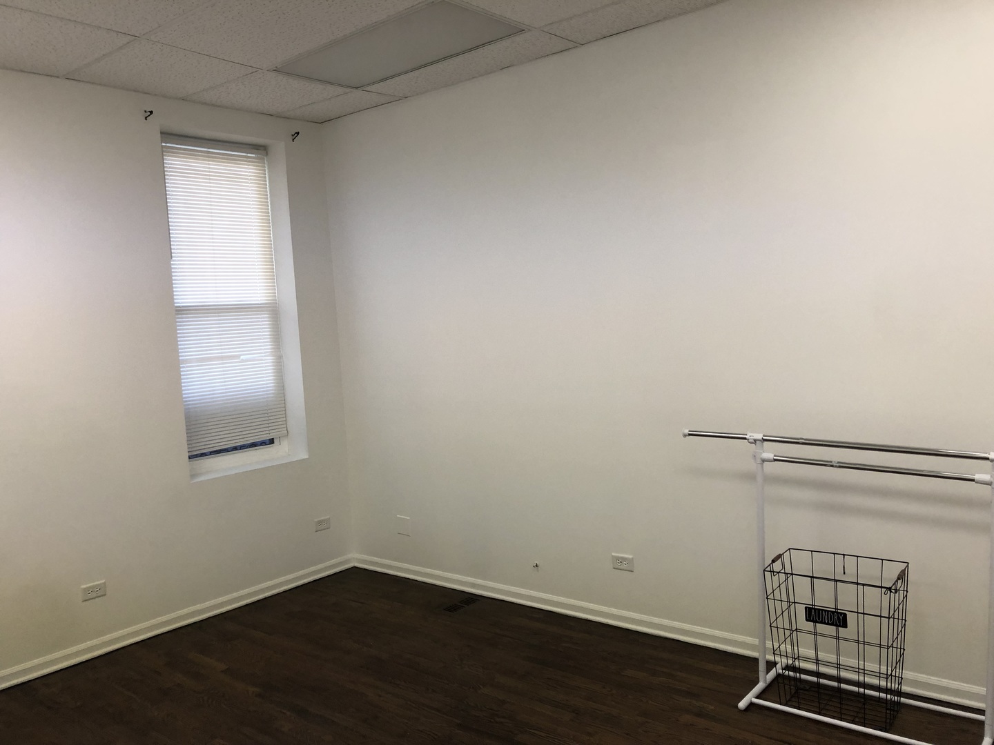 2449 North Clybourn Avenue, Unit 1 Chicago, IL 60614 - Photo 10 of 10 an empty room with wooden floor and windows