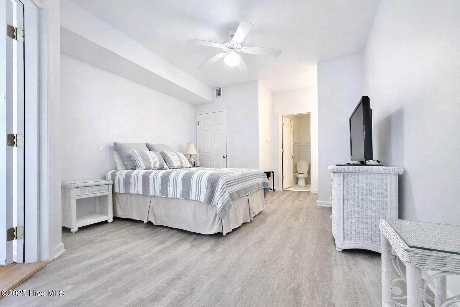 165 Royal Poste Road, Unit 2911 Sunset Beach, NC 28468 - Photo 11 of 24 Bright guest bedroom with neutral finishes and flexible layout for guests or home office; includes a separate entry door to the unit.