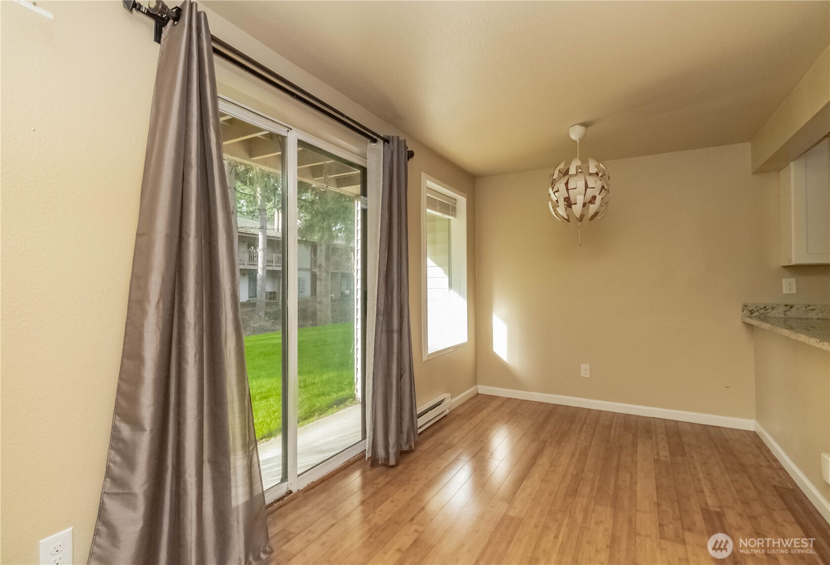 17425 119th Lane Southeast, Unit D12 Renton, WA 98058 - Photo 12 of 25 a view of an empty room with a window