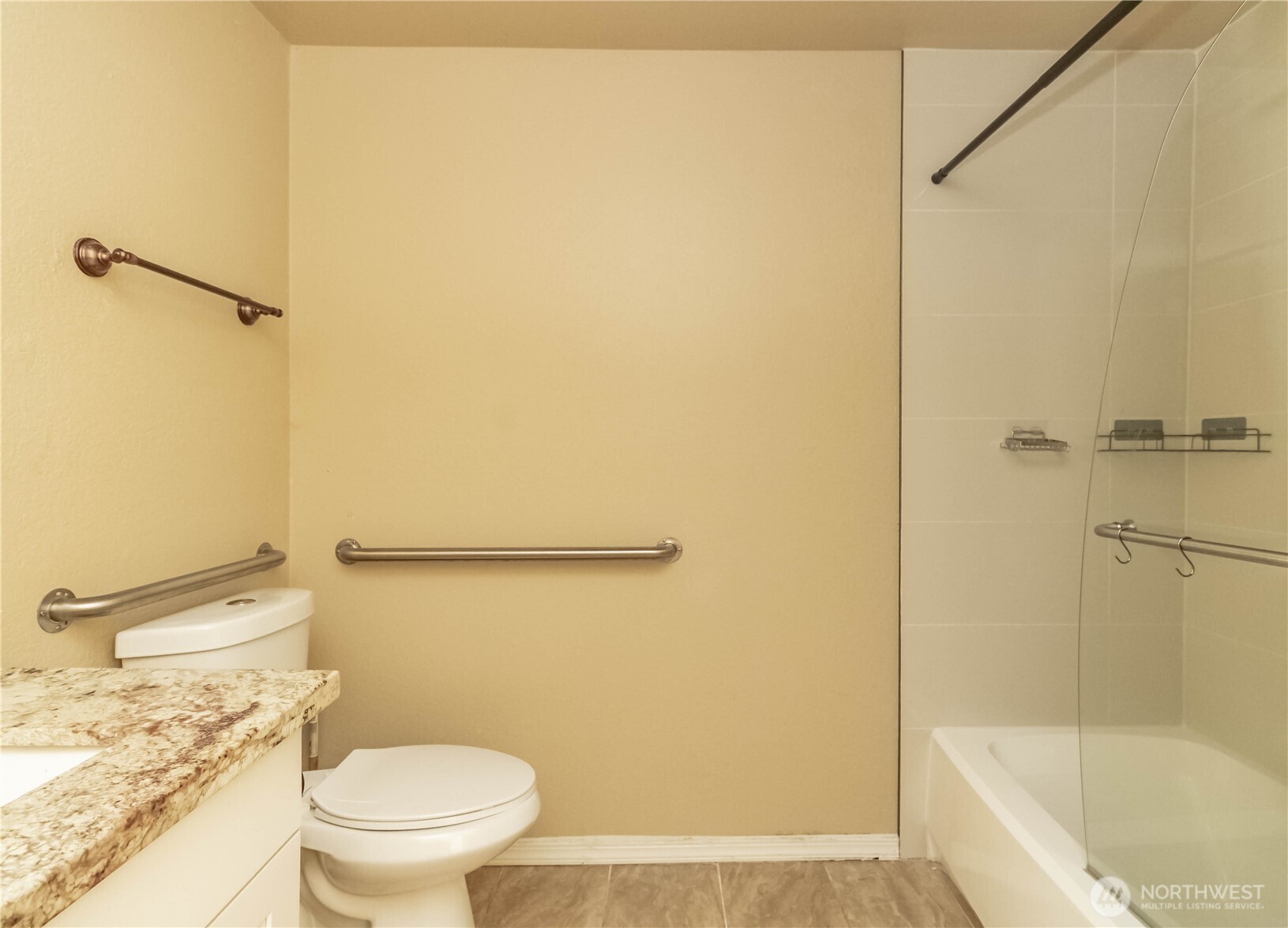 17425 119th Lane Southeast, Unit D12 Renton, WA 98058 - Photo 15 of 25 a white toilet sitting next to a bath tub