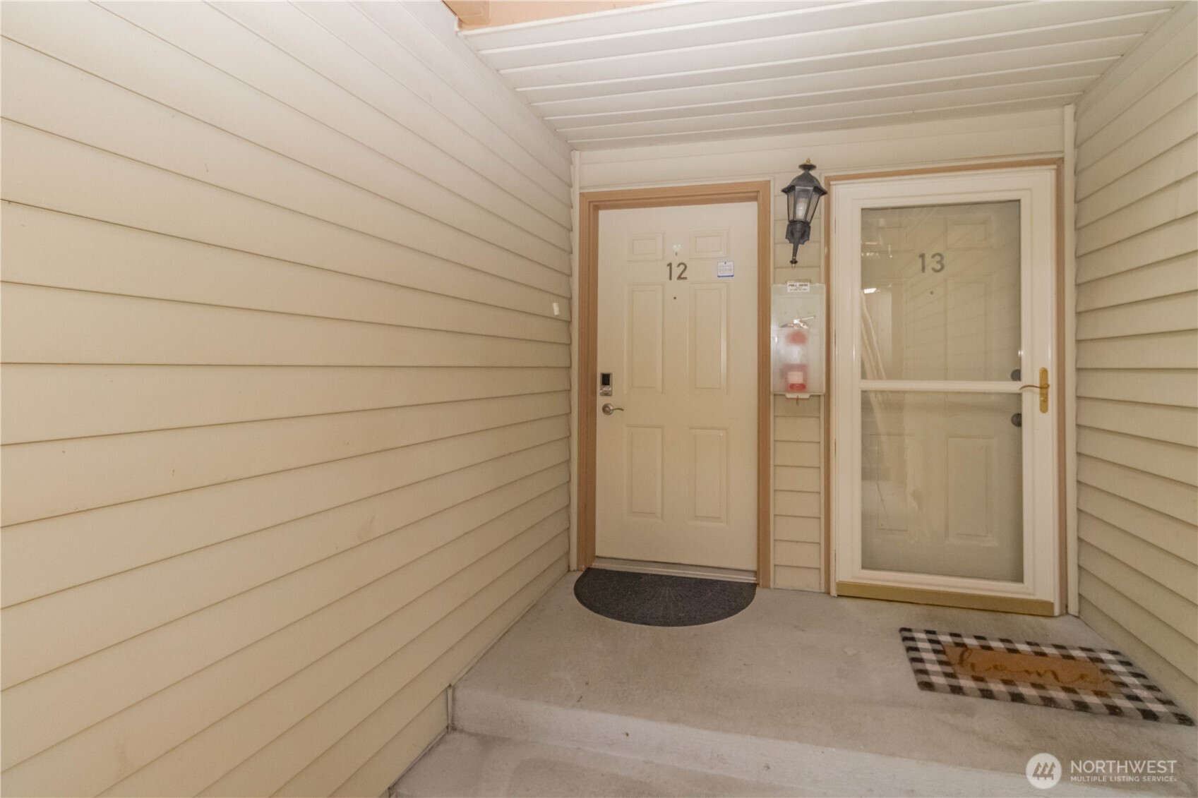 17425 119th Lane Southeast, Unit D12 Renton, WA 98058 - Photo 18 of 25 a view of a wooden door