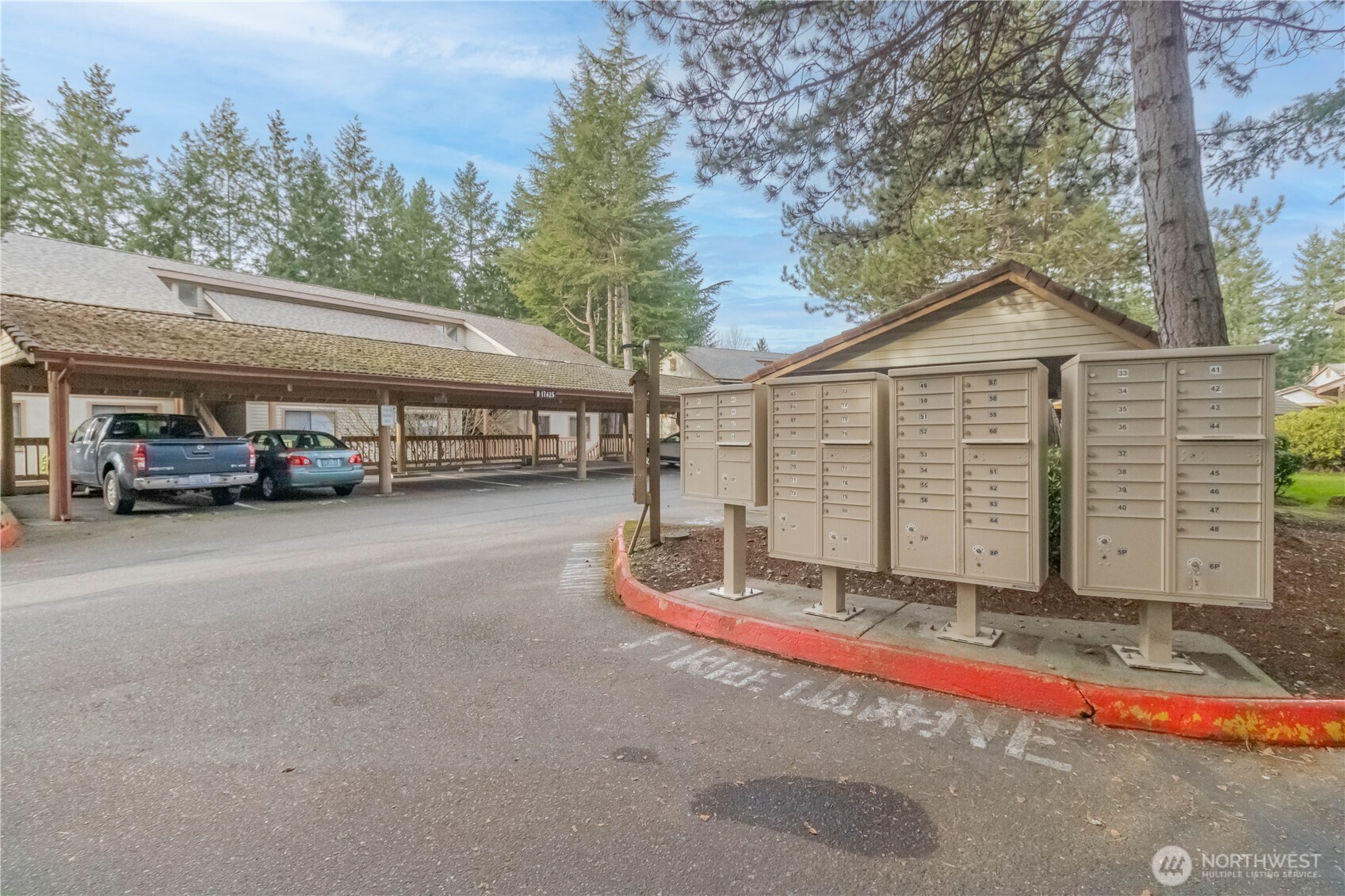 17425 119th Lane Southeast, Unit D12 Renton, WA 98058 - Photo 25 of 25 a car parked in front of a house