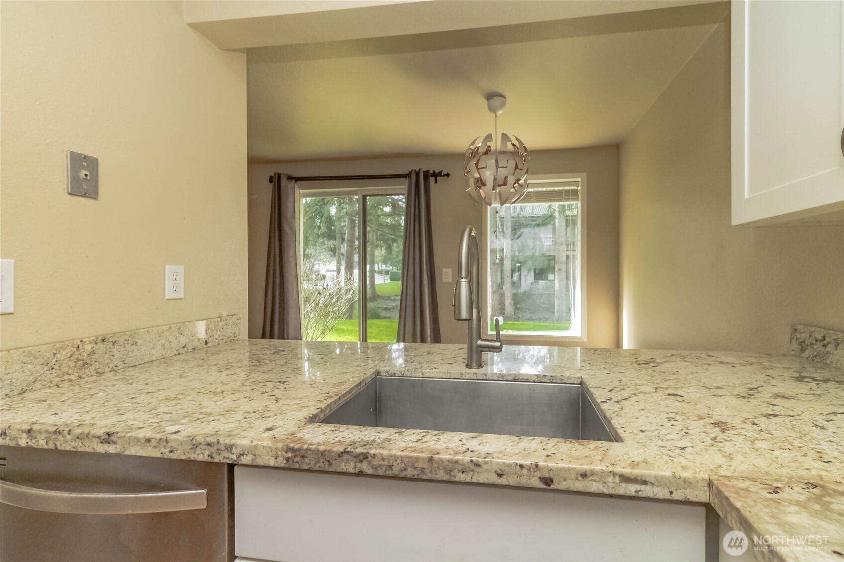 17425 119th Lane Southeast, Unit D12 Renton, WA 98058 - Photo 7 of 25 a view of a bathroom sink and a window