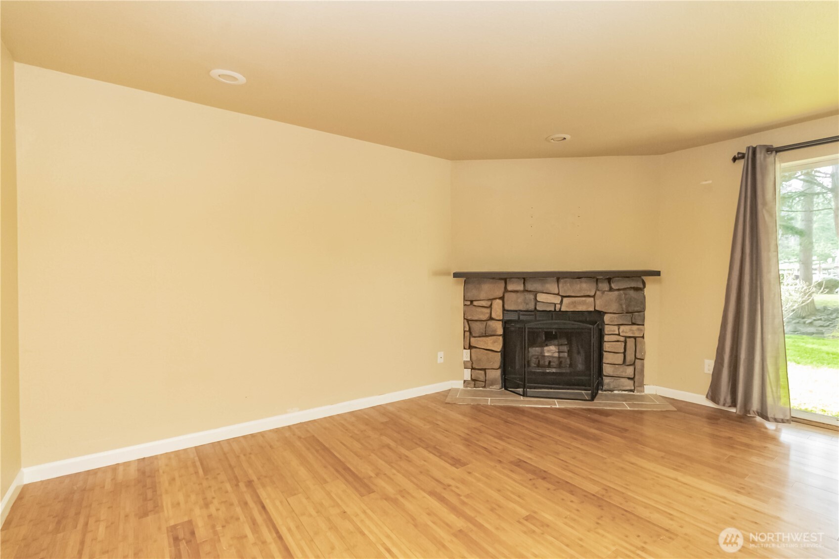 17425 119th Lane Southeast, Unit D12 Renton, WA 98058 - Photo 8 of 25 a view of empty room with a fireplace