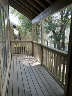 a view of balcony with wooden floor and outdoor space