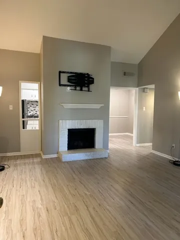 a kitchen with stainless steel appliances granite countertop a refrigerator a stove and a sink