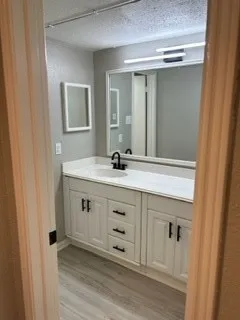 a white toilet sitting next to a bath tub