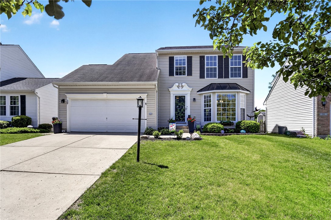 39 Holly Court Springboro, OH 45066 - Photo 2 of 42 This classic two-story home features a well-manicured lawn and a welcoming facade.