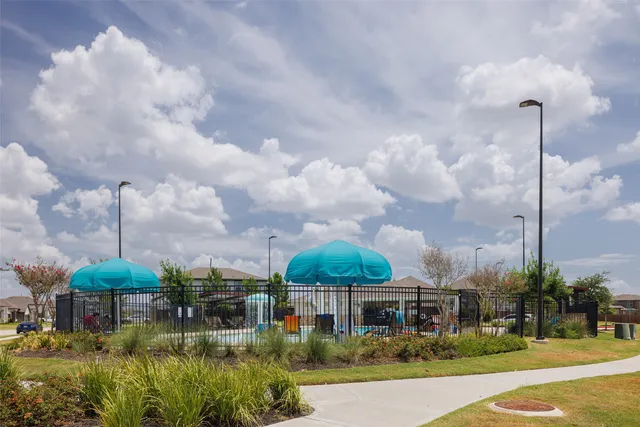a view of a city with a apartment building in the background