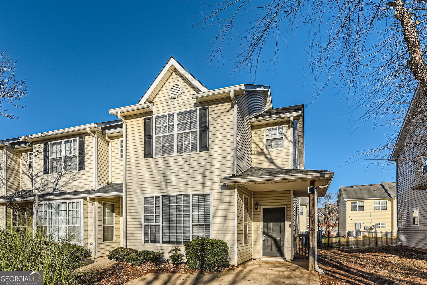 a front view of a house with large windows