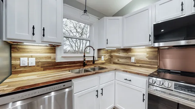 a kitchen with a sink and cabinets
