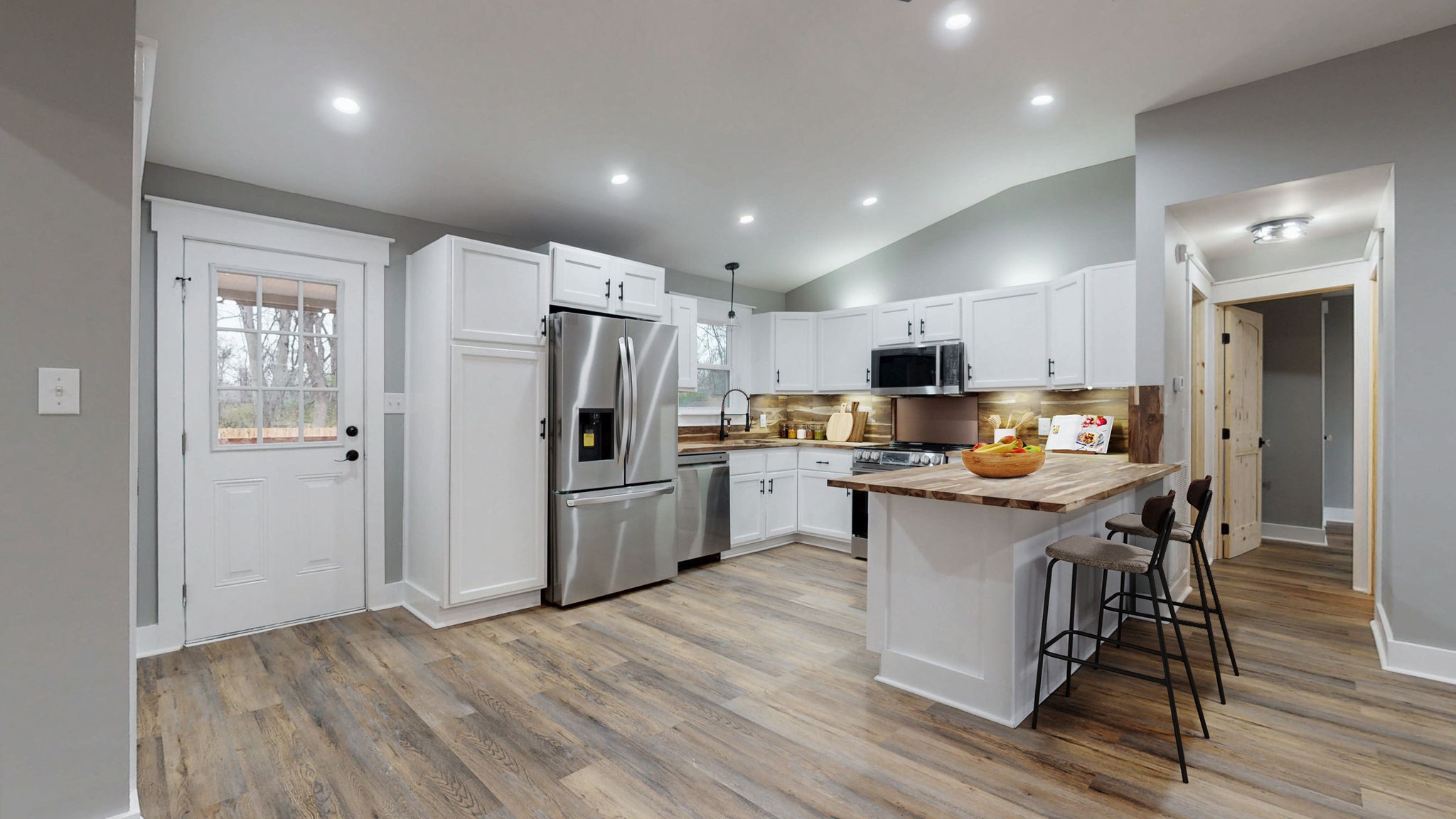 108 Decatur Street Shelbyville, TN 37160 - Photo 15 of 33 a kitchen with refrigerator and wooden floor