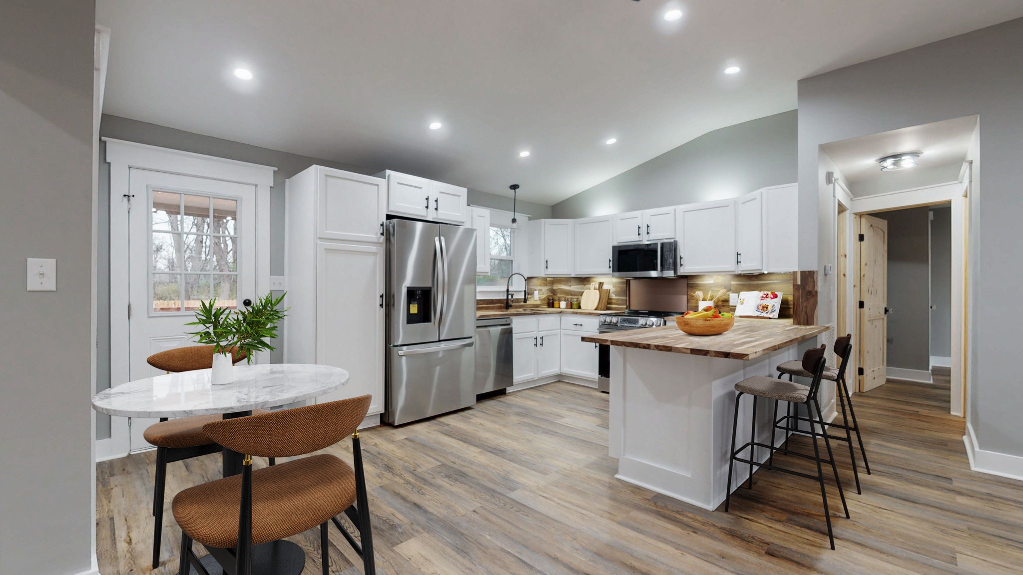 108 Decatur Street Shelbyville, TN 37160 - Photo 16 of 33 a kitchen with refrigerator a sink and chairs