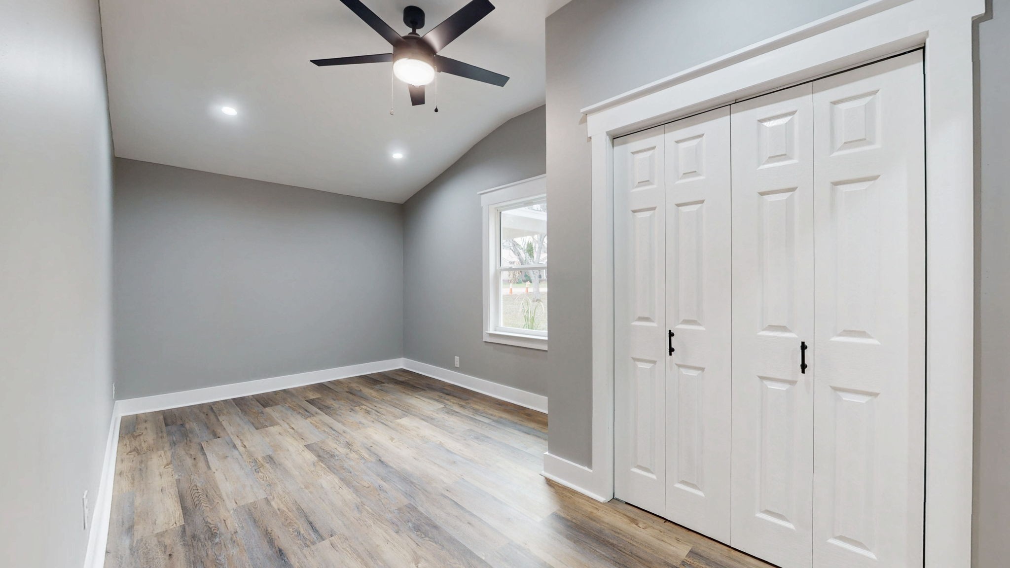 108 Decatur Street Shelbyville, TN 37160 - Photo 21 of 33 an empty room with wooden floor cabinet and windows