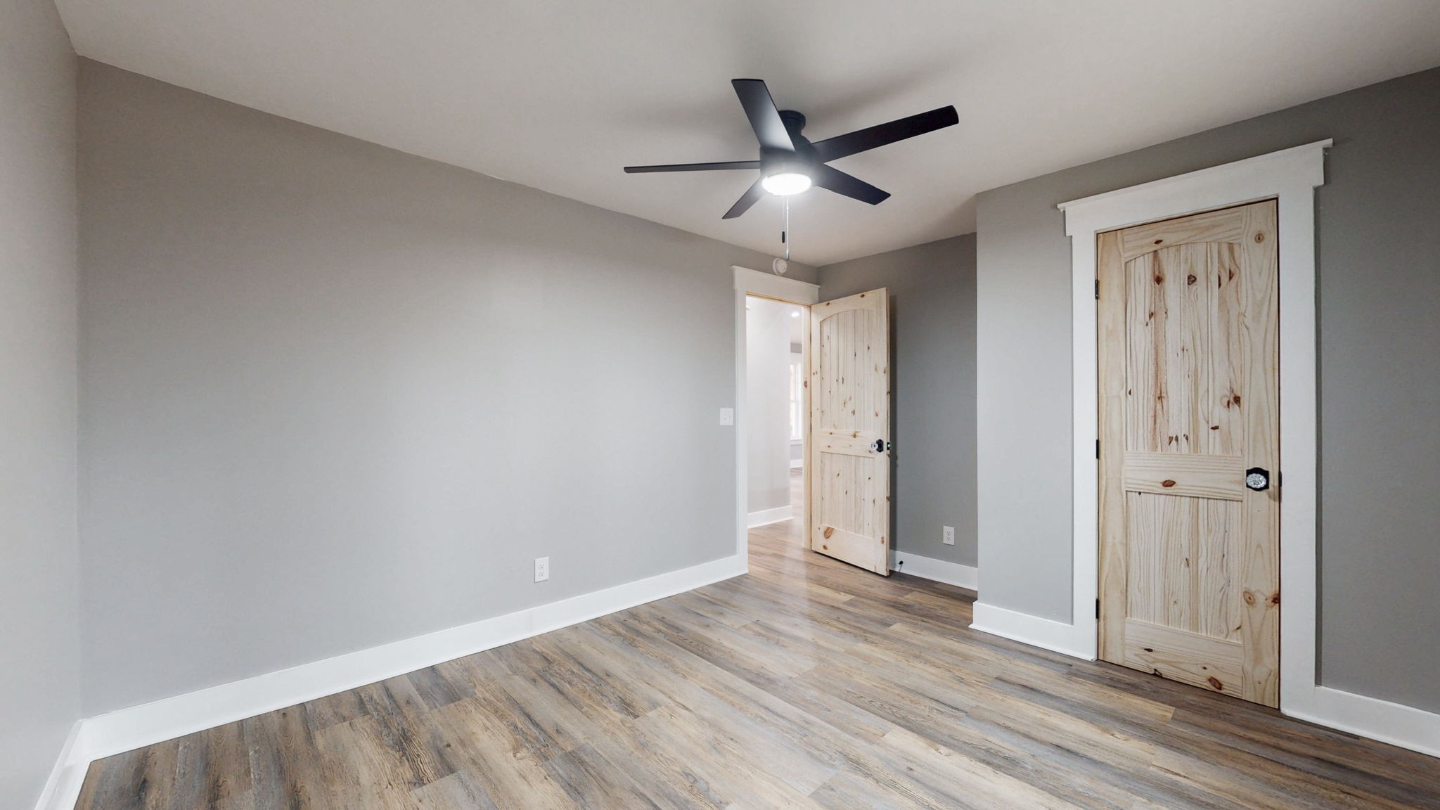108 Decatur Street Shelbyville, TN 37160 - Photo 25 of 33 an empty room with wooden floor and windows