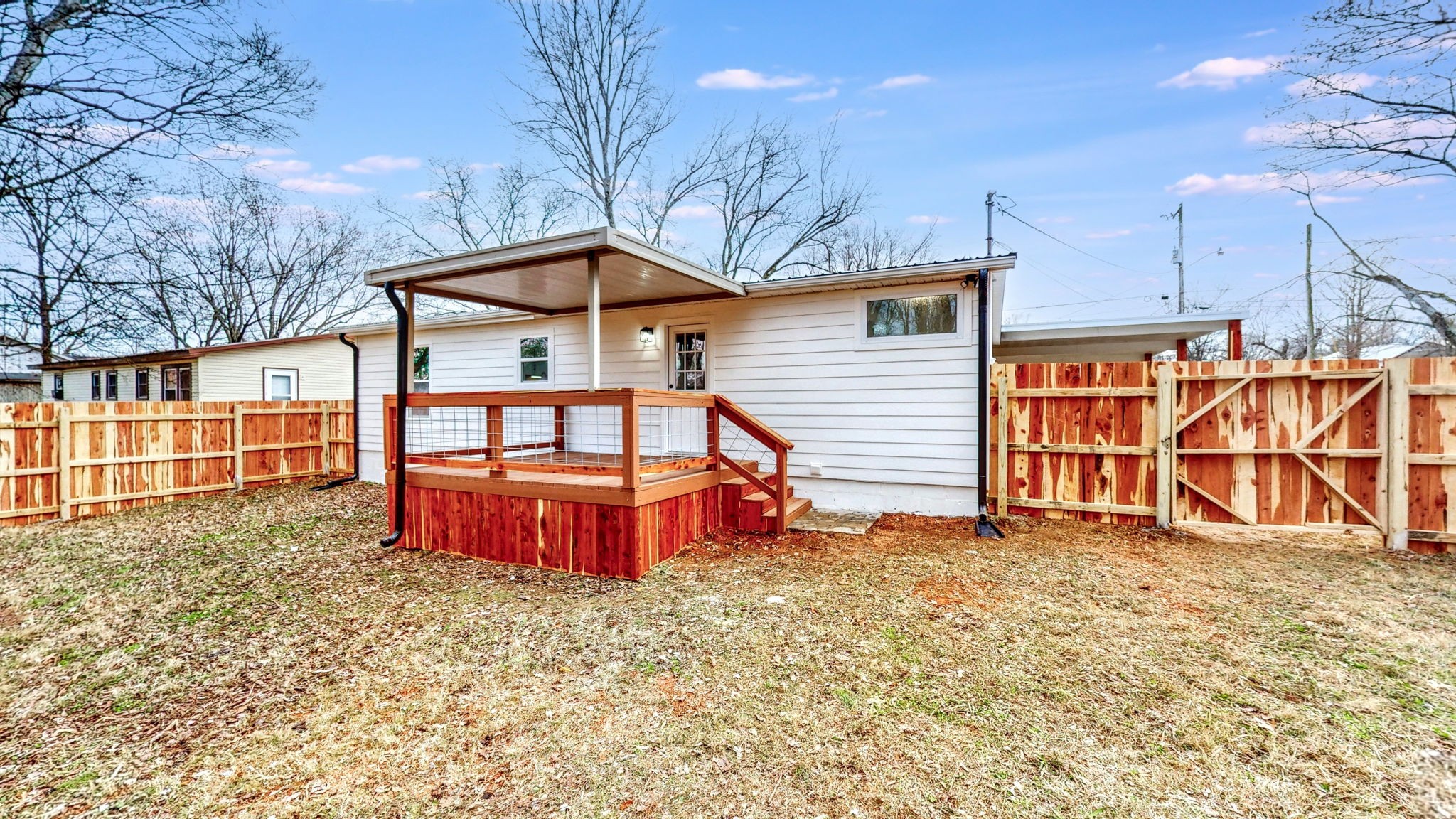 108 Decatur Street Shelbyville, TN 37160 - Photo 29 of 33 a view of a house with a yard and wooden fence