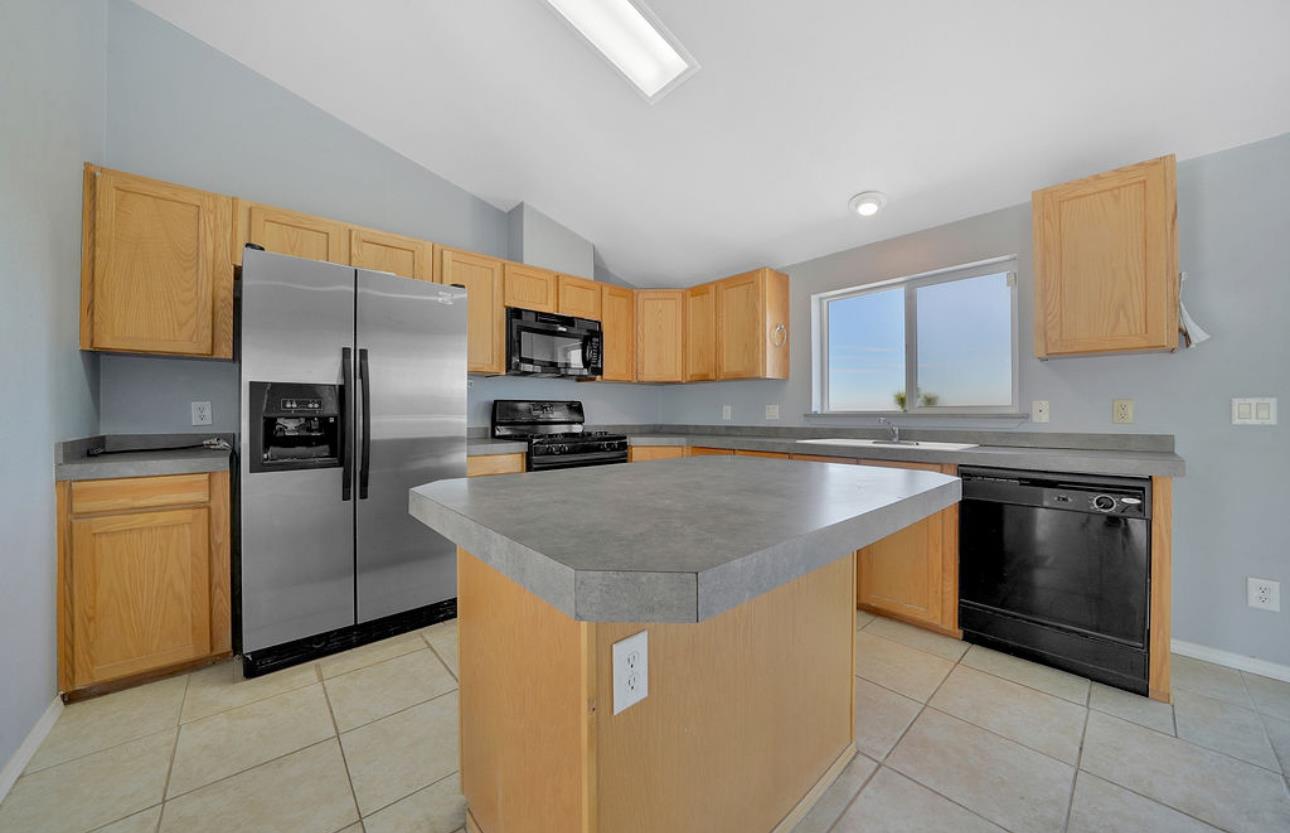 3155 Hawver Road San Andreas, CA 95249 - Photo 13 of 62 a kitchen with stainless steel appliances granite countertop a sink stove and refrigerator
