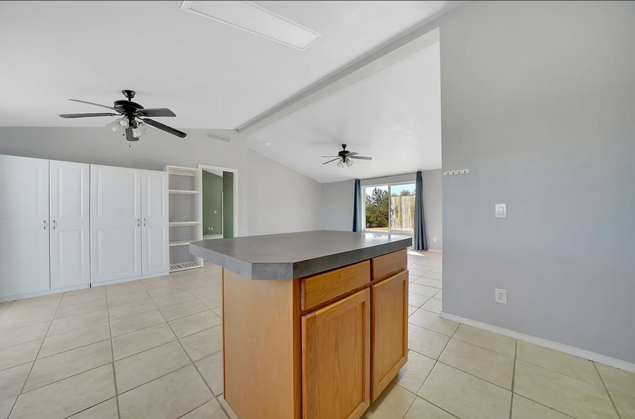 3155 Hawver Road San Andreas, CA 95249 - Photo 15 of 62 a kitchen with kitchen island granite countertop a sink and a stove top oven