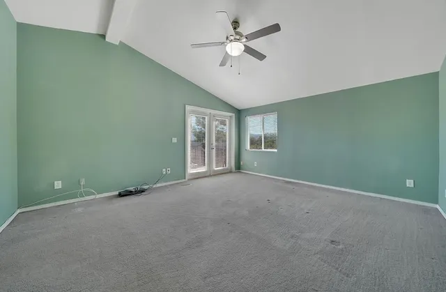 a bathroom with a granite countertop sink a toilet and bathtub