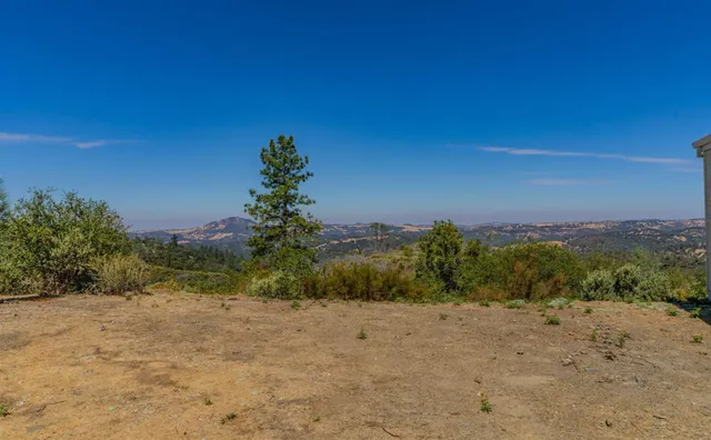 a view of a balcony with wooden floor and city view
