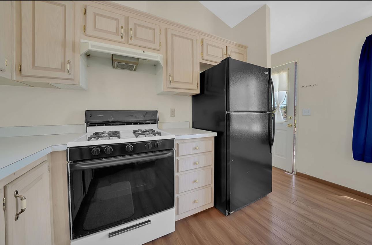 3155 Hawver Road San Andreas, CA 95249 - Photo 35 of 62 a kitchen with a stove microwave and refrigerator