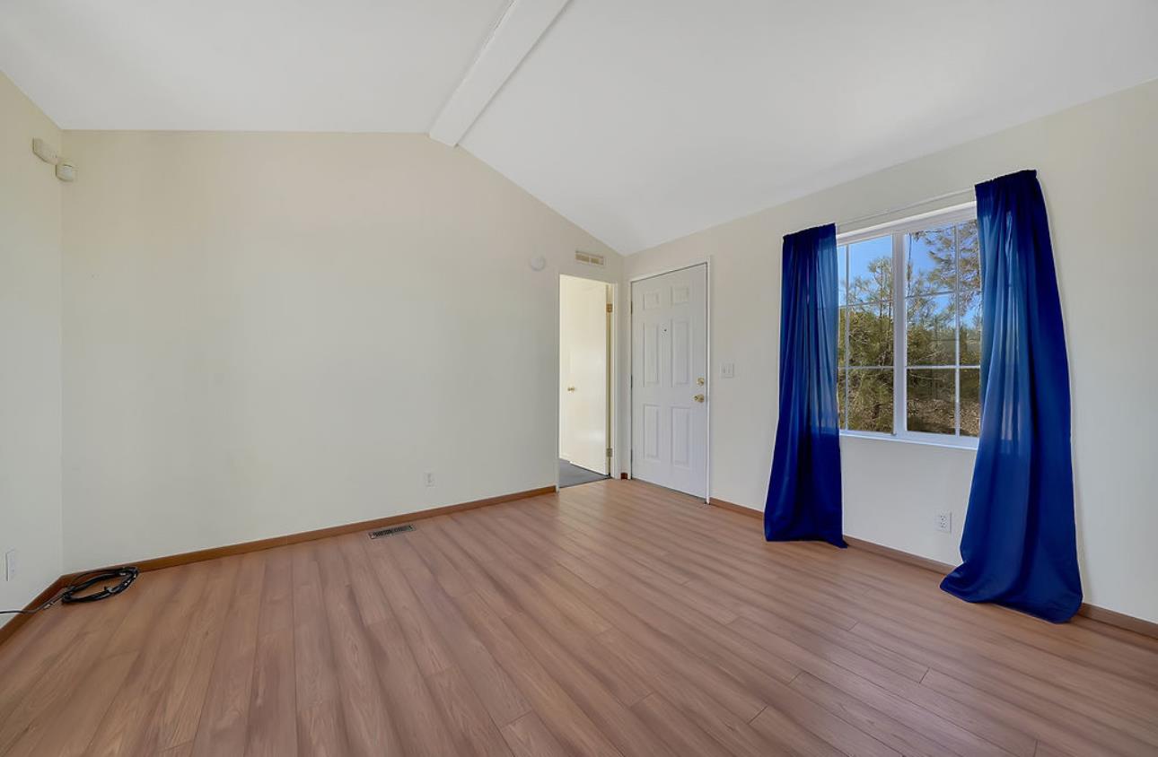 3155 Hawver Road San Andreas, CA 95249 - Photo 36 of 62 a view of an empty room with wooden floor and a window