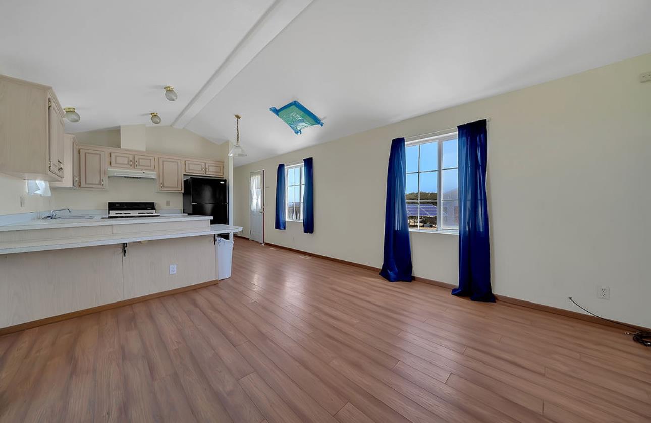 3155 Hawver Road San Andreas, CA 95249 - Photo 38 of 62 a large kitchen with stainless steel appliances granite countertop a large stove a sink dishwasher and a refrigerator with wooden floor