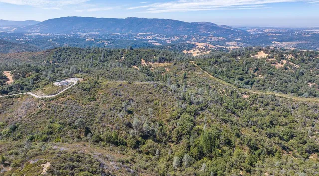 an aerial view of a house with a garden