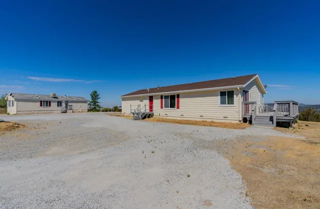 a view of a kitchen with an empty space and a window