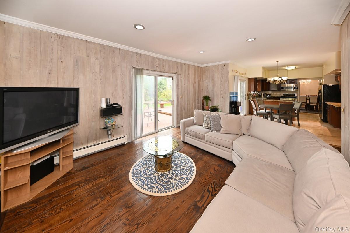 19 Sterling Road Spring Valley, NY 10977 - Photo 8 of 20 a living room with furniture and a flat screen tv