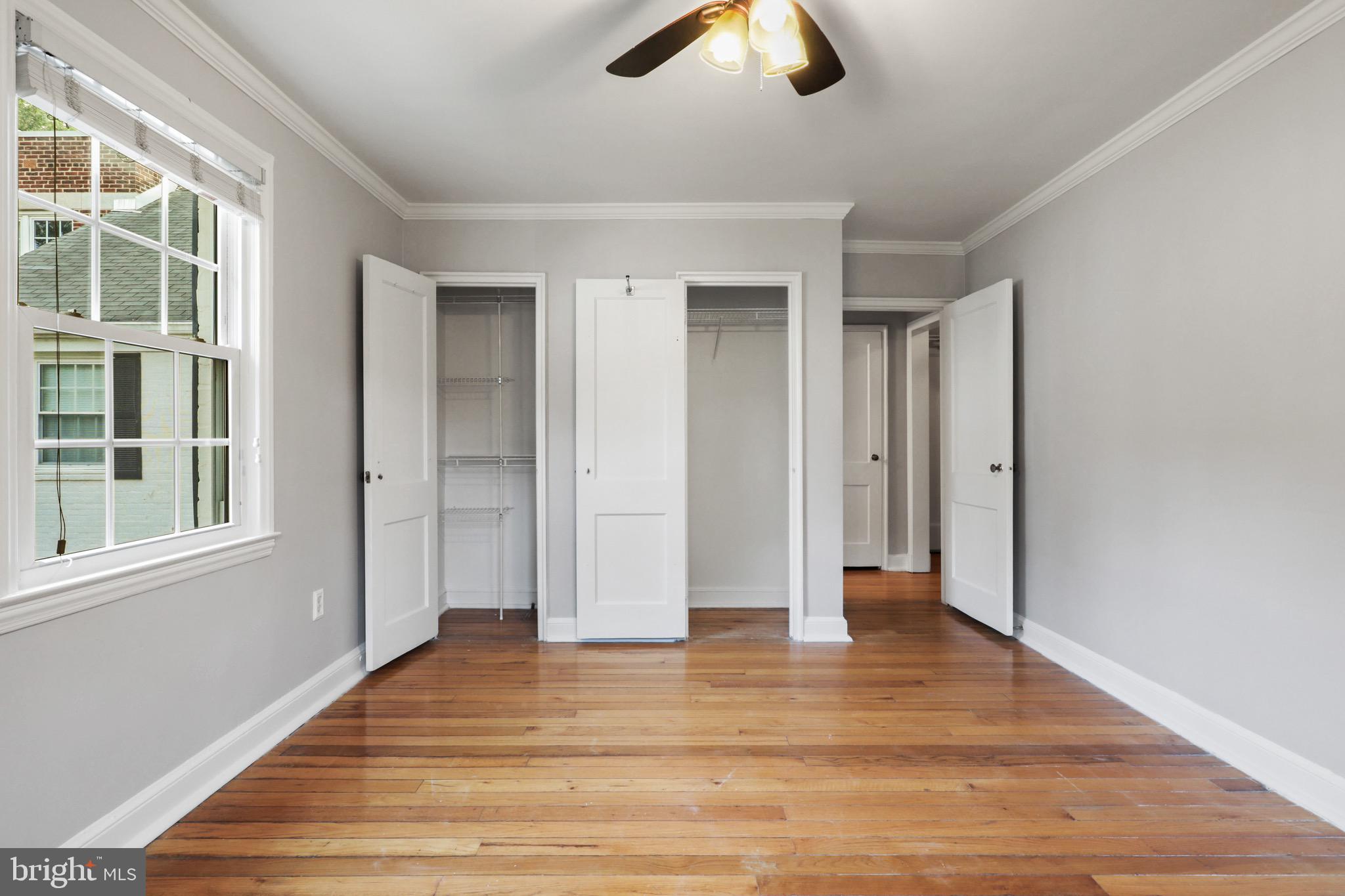 2912 13th Road South, Unit 204 Arlington, VA 22204 - Photo 14 of 32 a view of an empty room with window and wooden floor