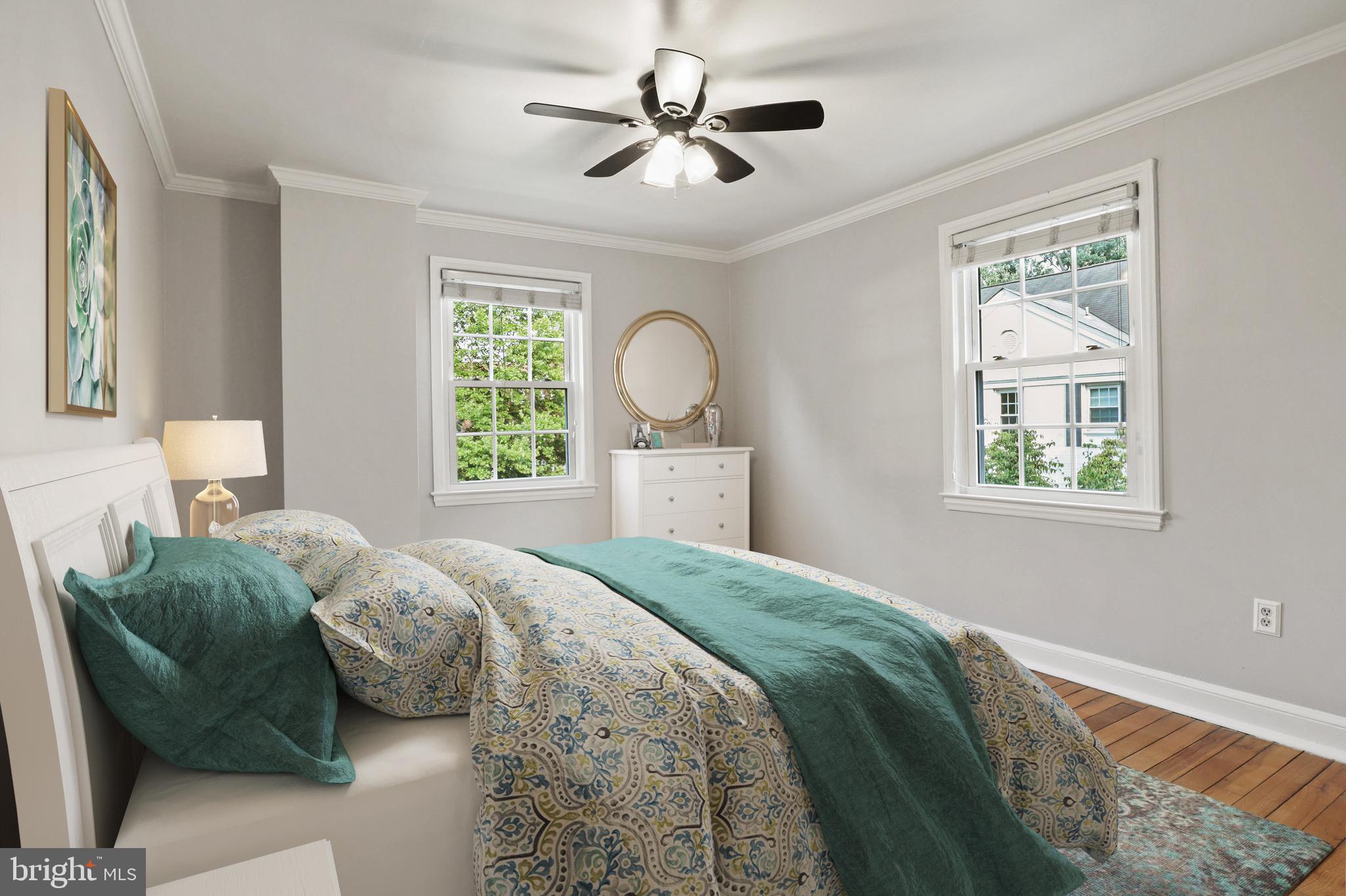 2912 13th Road South, Unit 204 Arlington, VA 22204 - Photo 17 of 32 a bedroom with a bed and a large window