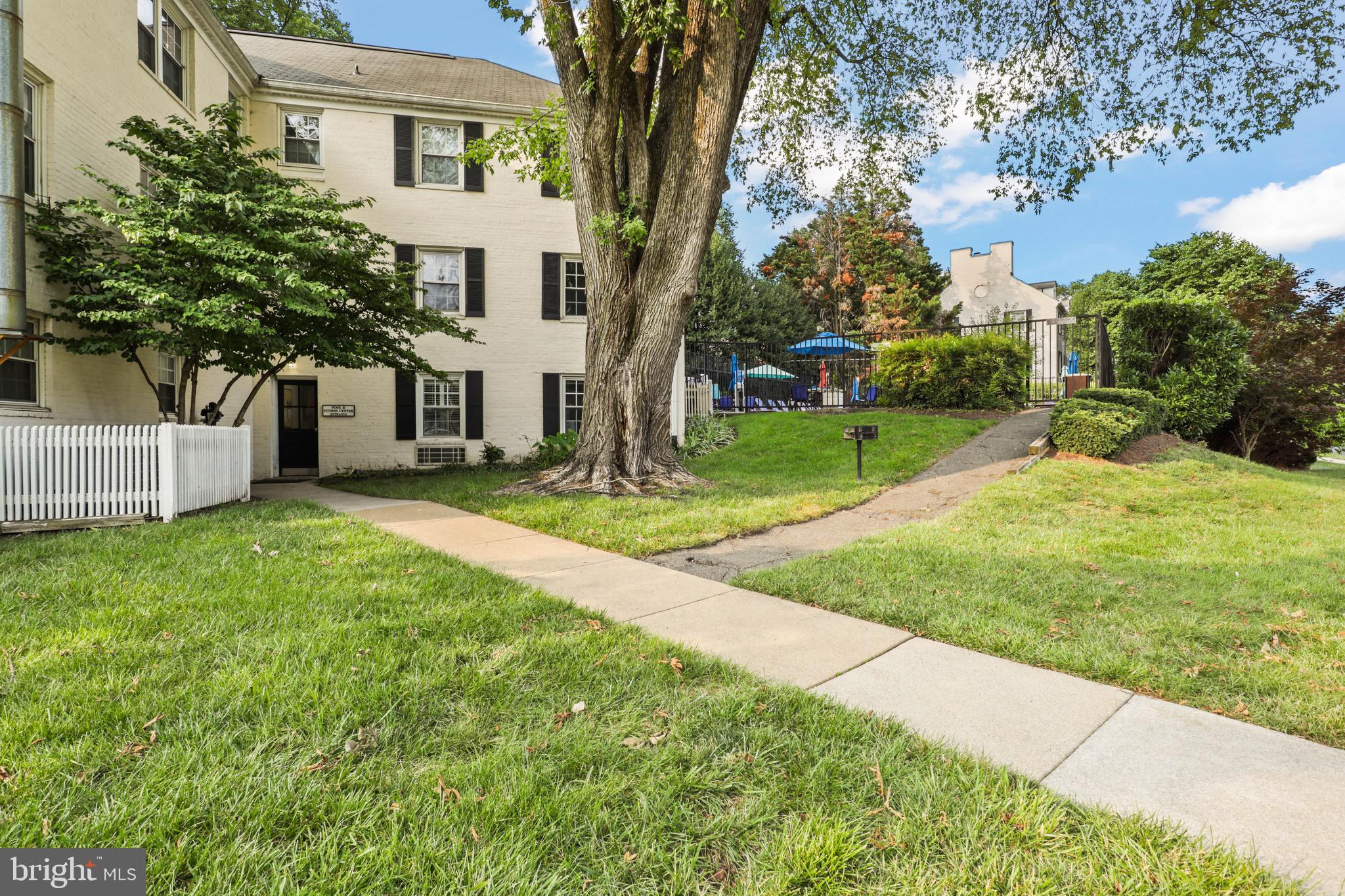 2912 13th Road South, Unit 204 Arlington, VA 22204 - Photo 2 of 32 a view of a house with a yard and tree s
