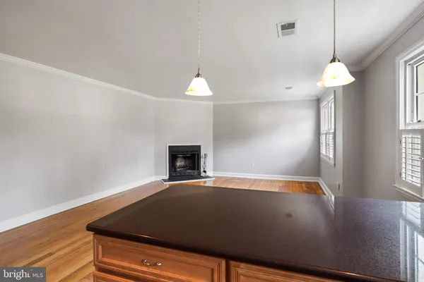 a view of room with fan and wooden floor
