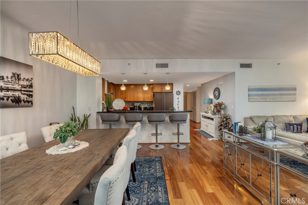 400 West Ocean Boulevard, Unit 902 Long Beach, CA 90802 - Photo 12 of 32 a living room with furniture and a wooden floor