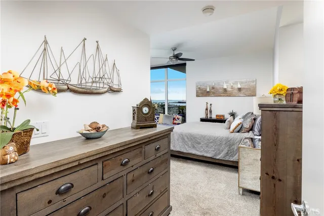 a bedroom with a bed and cabinets