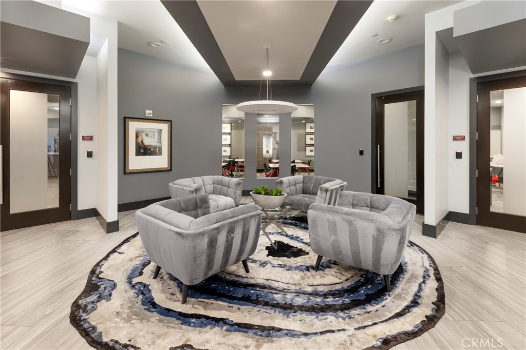 400 West Ocean Boulevard, Unit 902 Long Beach, CA 90802 - Photo 27 of 32 a living room with furniture and a chandelier