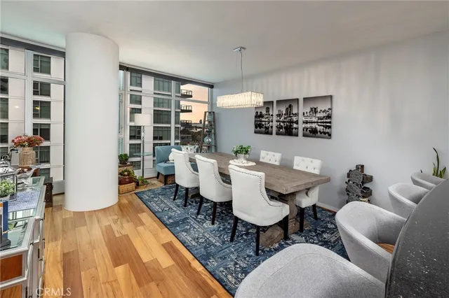 a dining room with furniture and wooden floor