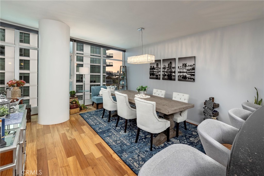 400 West Ocean Boulevard, Unit 902 Long Beach, CA 90802 - Photo 8 of 32 a dining room with furniture and wooden floor