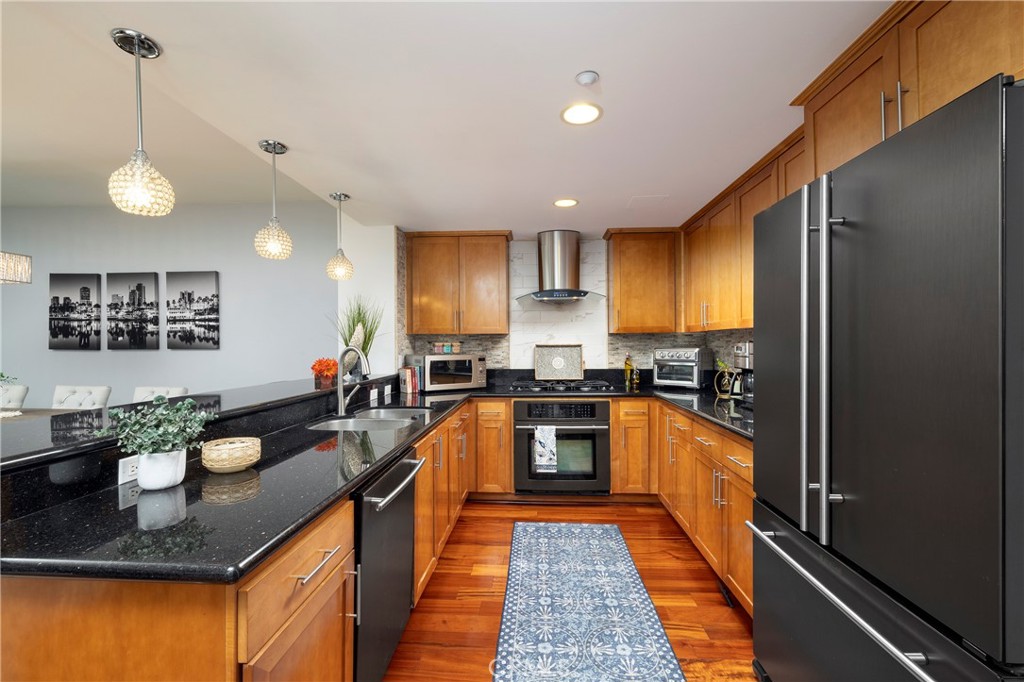 400 West Ocean Boulevard, Unit 902 Long Beach, CA 90802 - Photo 9 of 32 a large kitchen with granite countertop lots of counter top space