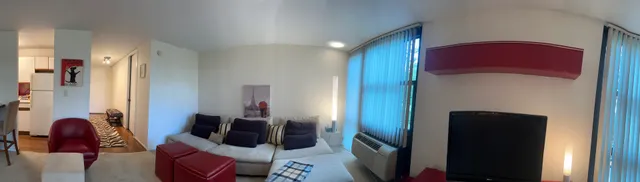 a living room with furniture and a window