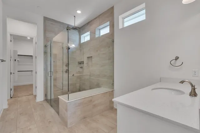a bathroom with a sink and a shower