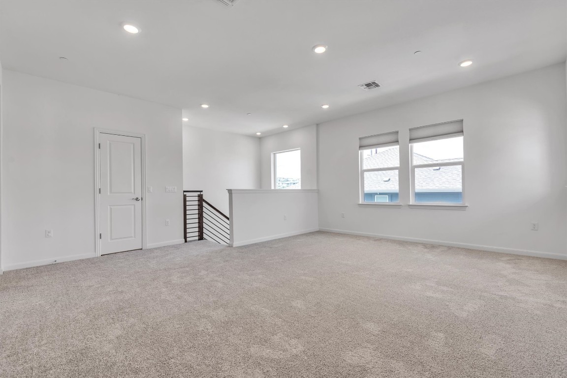 12110 Moriah Bend Austin, TX 78732 - Photo 20 of 40 an empty room with windows and closet