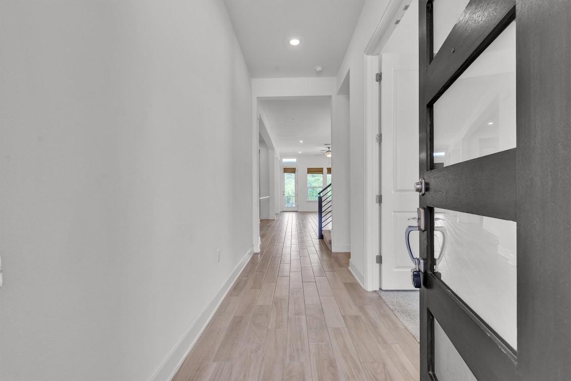 12110 Moriah Bend Austin, TX 78732 - Photo 2 of 40 a view of hallway with wooden floor