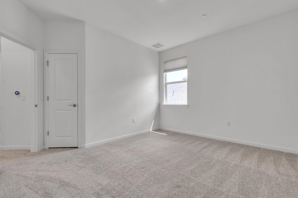 12110 Moriah Bend Austin, TX 78732 - Photo 30 of 40 an empty room with windows