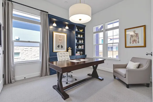 a view of a livingroom with furniture and window