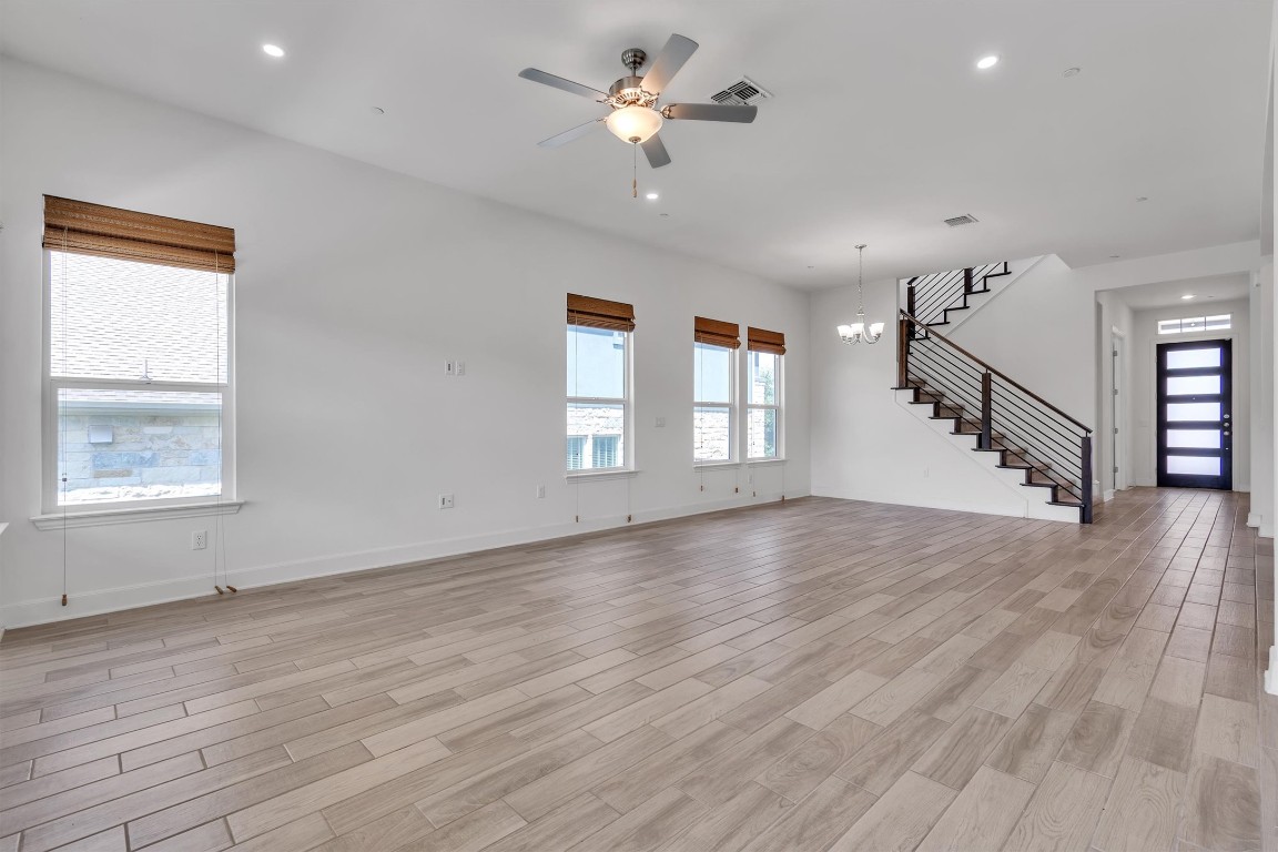 12110 Moriah Bend Austin, TX 78732 - Photo 9 of 40 wooden floor in an empty room with a window