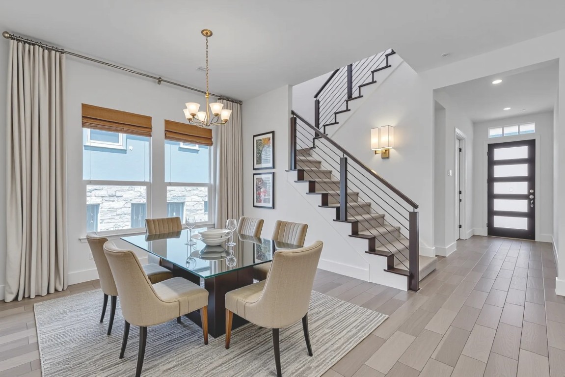 12110 Moriah Bend Austin, TX 78732 - Photo 10 of 40 a view of a dining room with furniture window and wooden floor