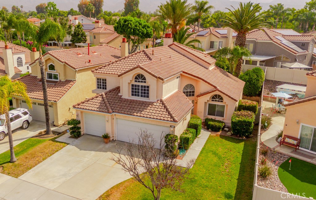 7787 Jack Rabbit Lane Highland, CA 92346 - Photo 1 of 1 a view of a white house with a small yard and large trees