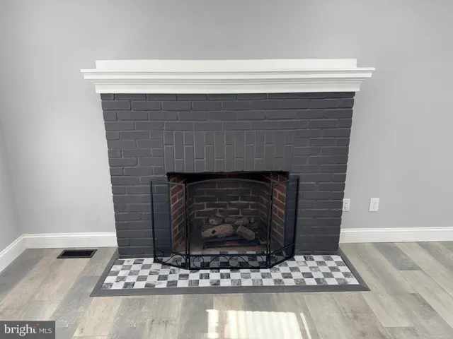 a living room with fireplace
